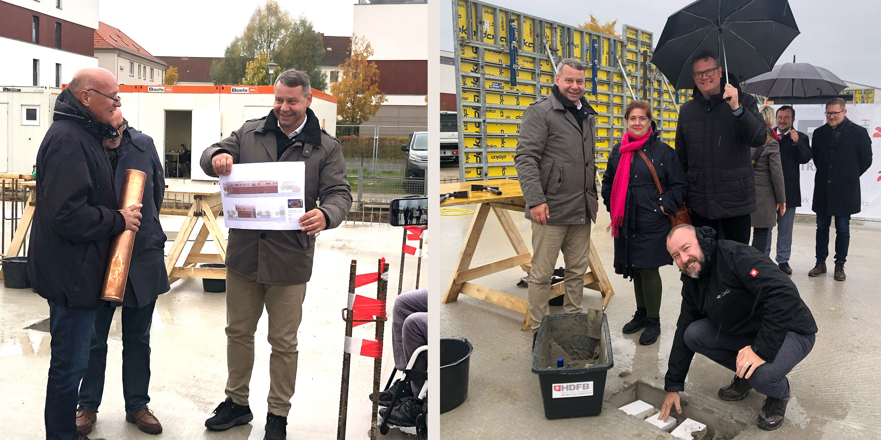 Grundsteinelgung für einen Neubau. Menschen stehen auf der einer Bautstelle und bereiten die Versenkung einer Zeitkapsel vor.